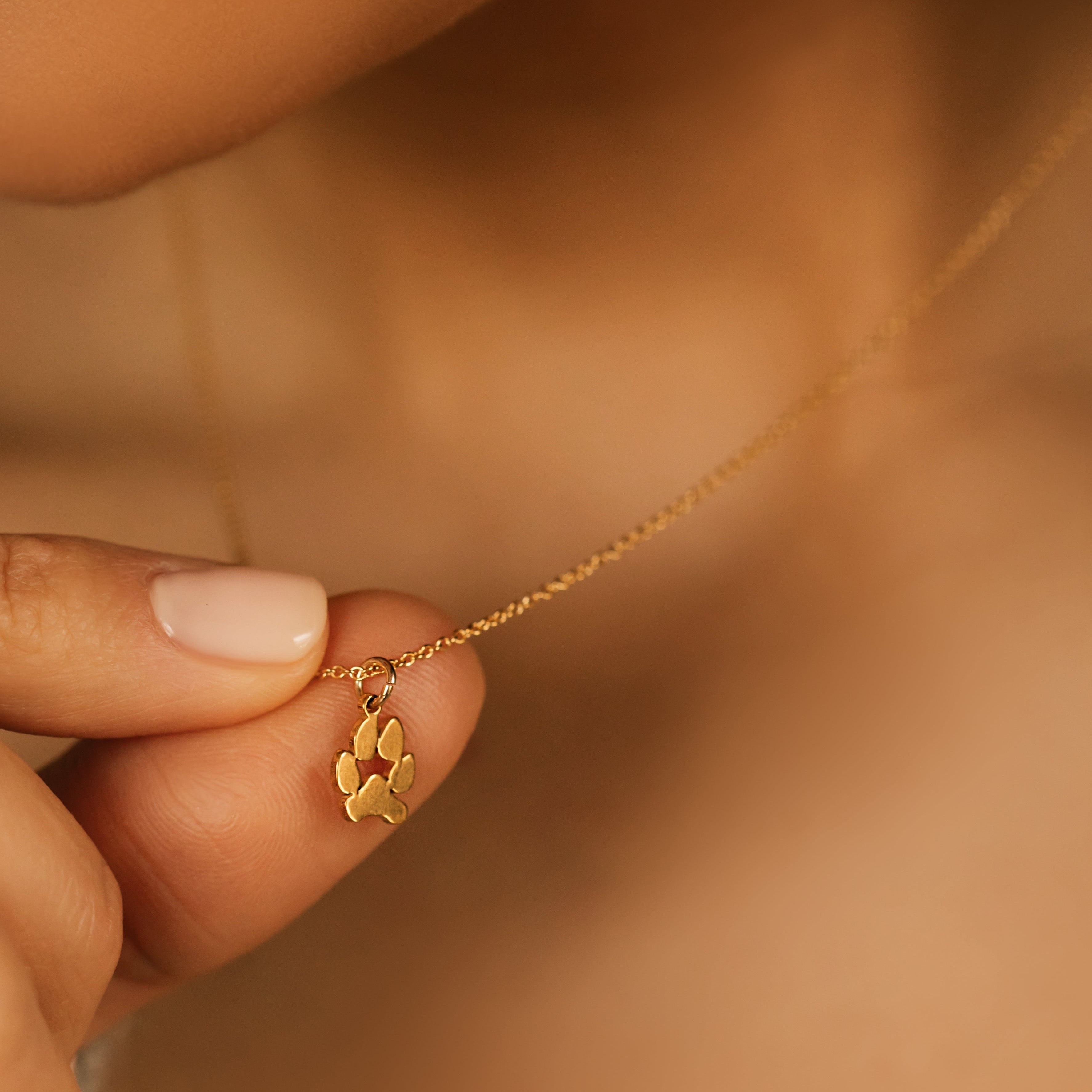 gold paw print necklace made from actual paw prints