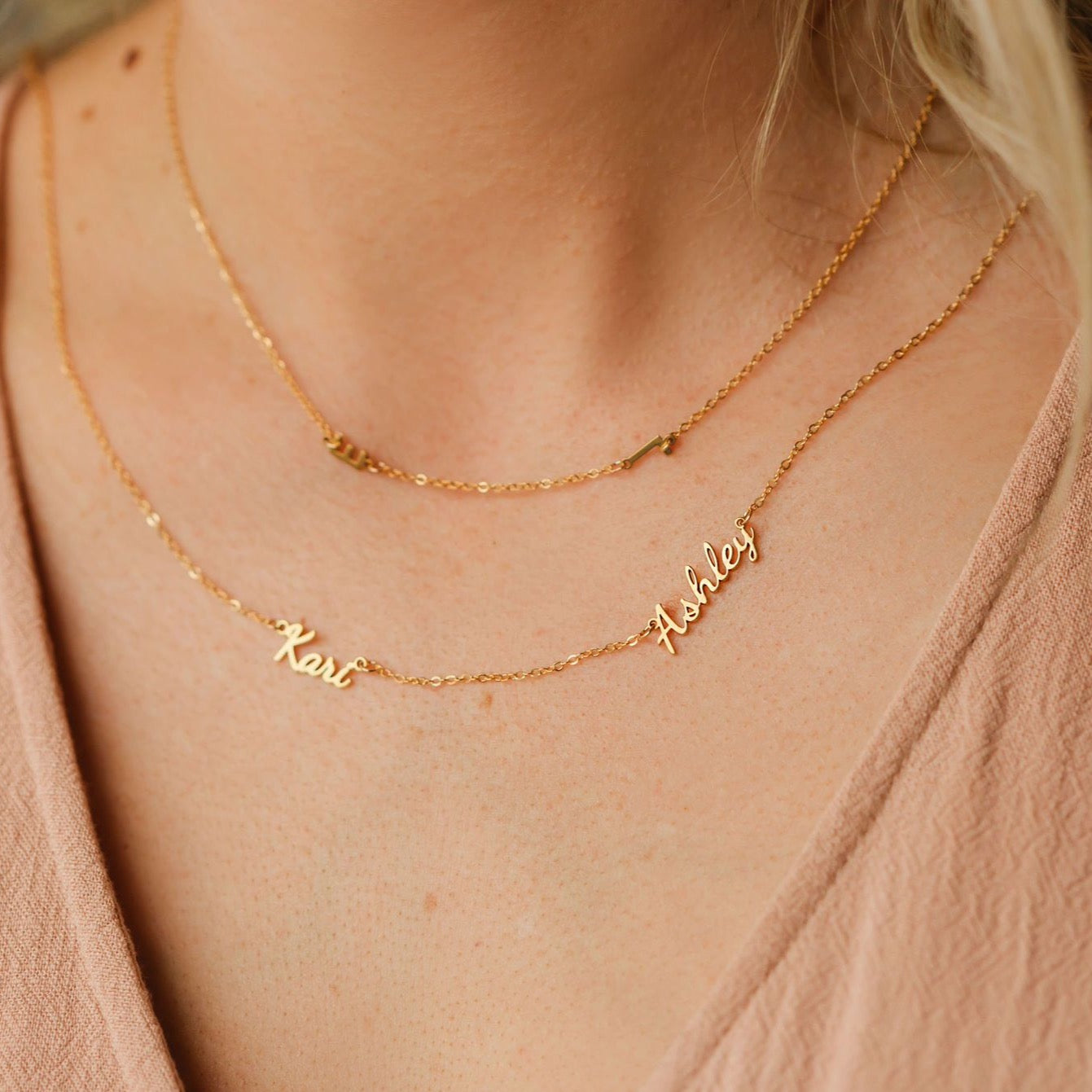multiple name necklace layered with side initial letter necklace